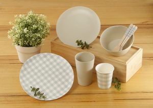 Some of Coles' new reusable and single-use tableware range.